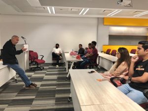 Dr. Pintak addressing students