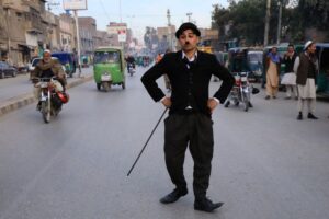 Charlie Chaplin in the streets of Peshawar.