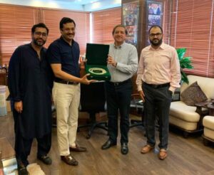 Farhan Hanif Chairman Crown Group present souvenir to the Senator Saleem Mandviwala