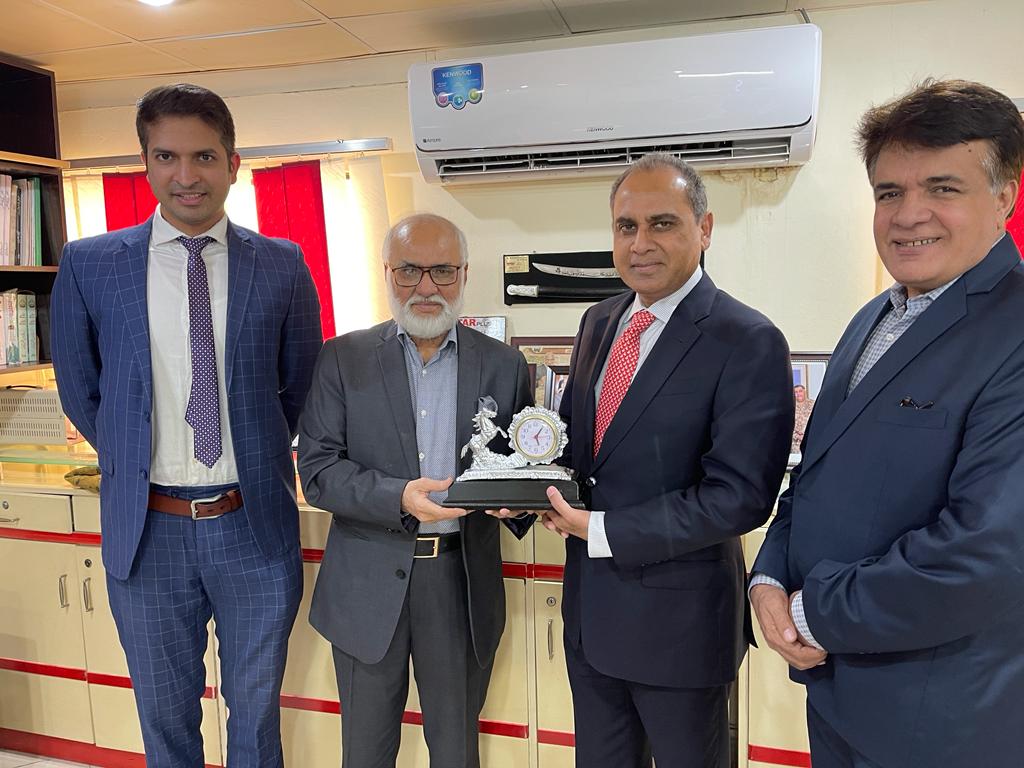 Mahmood Ahmad Khan present shield to the Dr. Mubashir Chaudhry