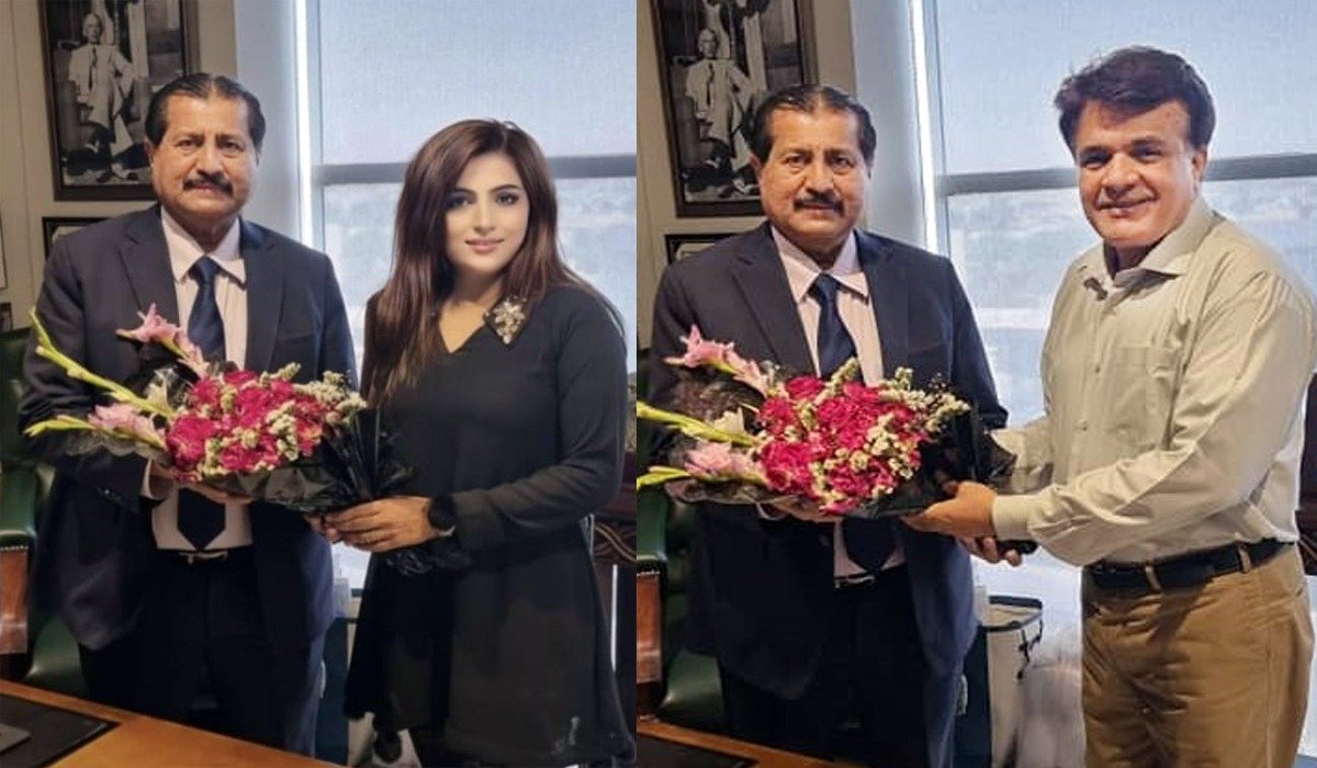 Reeha Malik and Syed Turab Shah presented flower bouquet to Dr.Mirza Ikhtiar Baig.