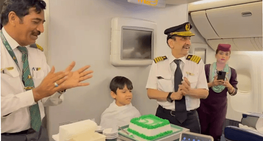 PIA flight On Jeddah the little passenger cut the Independence Day cake.