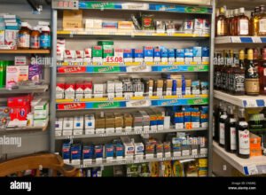 cigarette-display-behind-a-shop-counter-C46AKJ