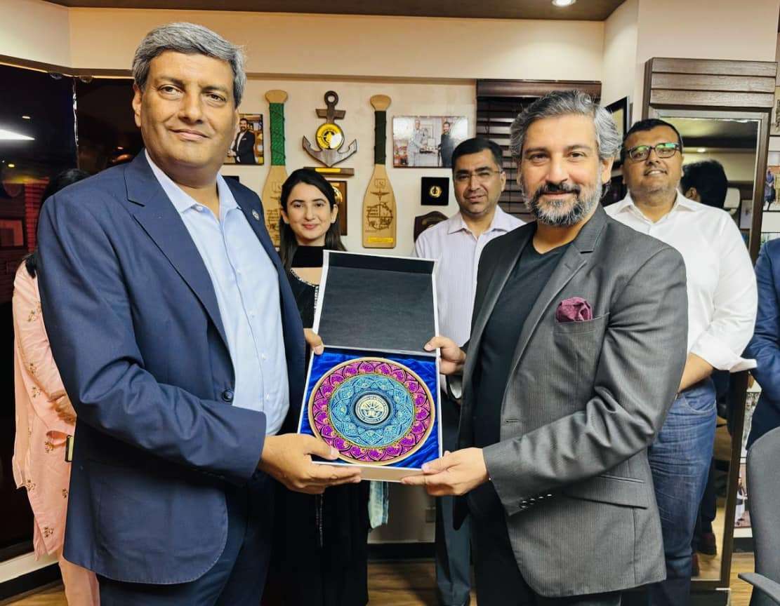 Danish Aman Receiving a crest from Air Vice Martial( R )Dr Rizwan Riaz.