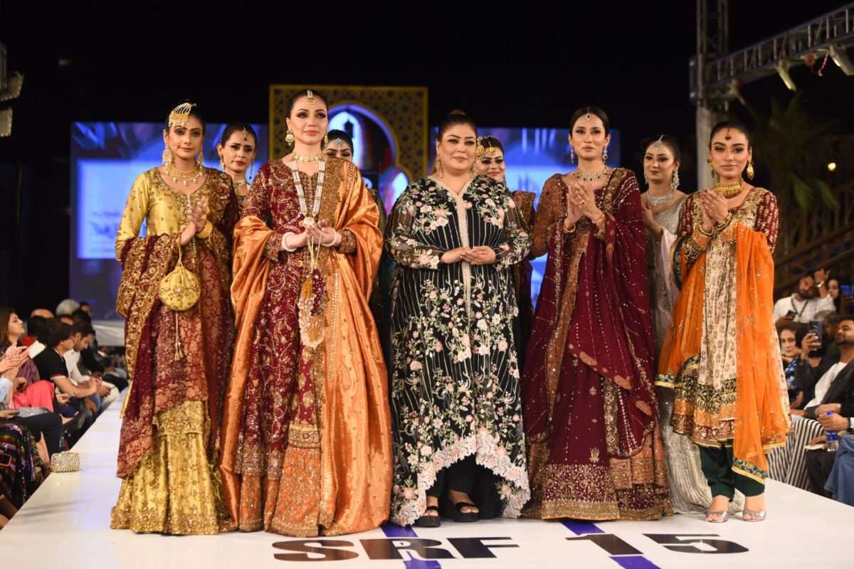 Chief Executive Officer Spotlight Salon Asma Naaz walking with models at SRF Fashion Show.