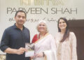Parveen Shah is presenting her book  “AMMA KI BITYA” to Khurram Sher Zaman of Pakistan Tehreek-e-Insaf.