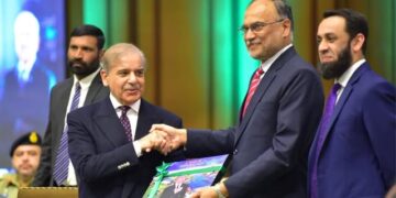 Prime Minister being presented a book on one-year performance of the government by Prof Dr Ahsan Iqbal