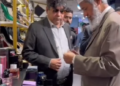 Dr. Zakir Naik is shopping at the outlet of Pakistan’s prominent businessman Shahzad Mubeen in a local shopping center.
