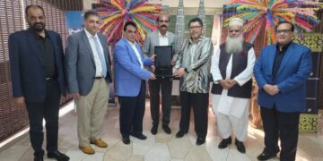Asad Fecto is receiving PMFA Appreciation Memento from. Mr.Herman Hardynata Ahmad Consul General of Malaysia
