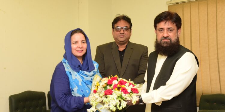 Mrs. Irum Tanweer was graced with bouquet of flowers by the officers of Press Information Department