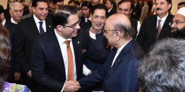 Hamza Tabani, is shaking hands with President Asif Ali Zardari