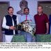Zahid Iqbal Chaudhry, presents flowers to Ikram Rajput,