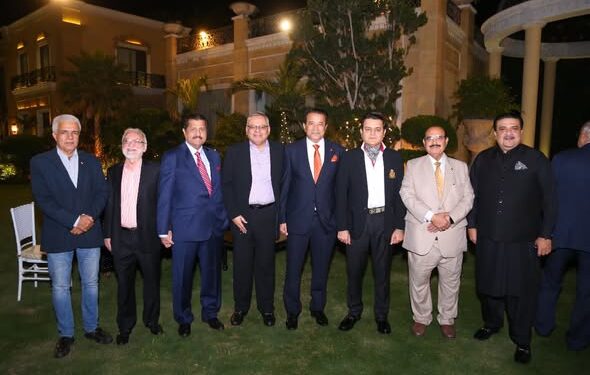 Dr. Mirza Ikhtiar Baig, to a distinguished dinner reception welcoming Mr. Charles Goodman,
