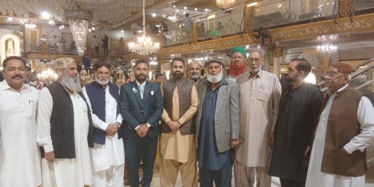 A group photo featuring distinguished personalities from the community alongside senior journalist Sirajuddin Amjadi at the wedding reception (Walima)