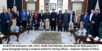 Sindh Chief Minister Syed Murad Ali Shah poses for a group photograph during a reception hosted for retiring officers