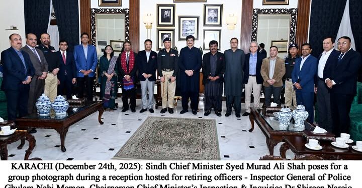 Sindh Chief Minister Syed Murad Ali Shah poses for a group photograph during a reception hosted for retiring officers