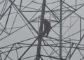 Girl climbs high voltage tower for love.