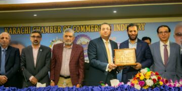 Muhammad Rehan Hanif presenting crest to Federal Minister for National Health Services Regulation and Coordination Syed Mustafa Kamal during his visit to KCCI on Monday.