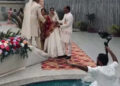 Wedding photo shoot, photographer falls into swimming pool.