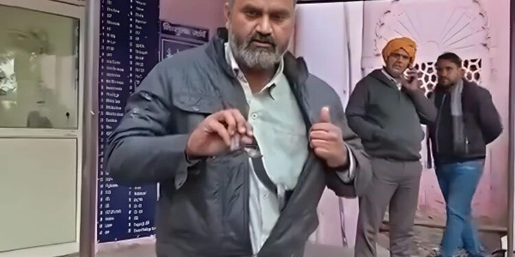 Man bitten by snake reaches hospital with snake wrapped in jacket.