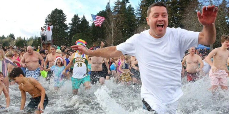 Thousands of People Took a Dip in the Cold Water to Set a Record.