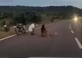 Couple blocks highway for photo shoot.