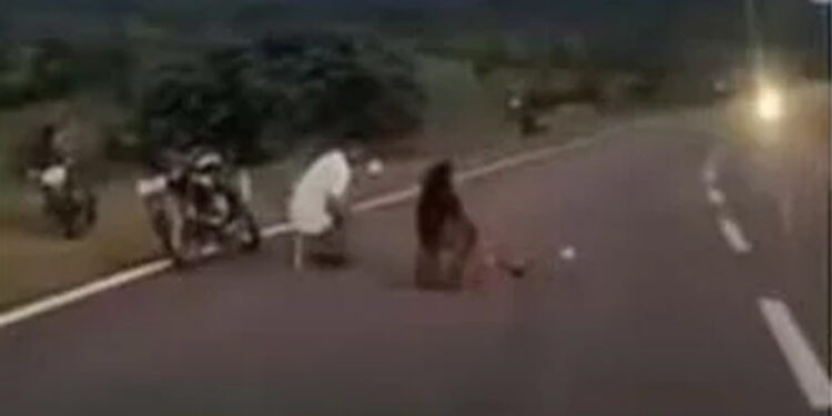 Couple blocks highway for photo shoot.