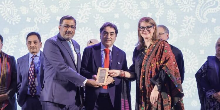 Abdul Hameed Aslam  Rceived award from Christine Etienne Director Rotary International