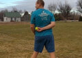 Tennis ball caught behind back from a long distance, new world record set.