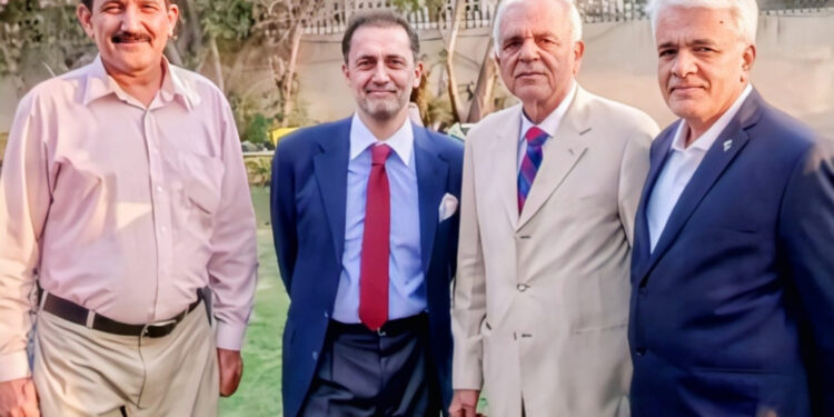 A group photograph taken of Commodore  (R) Sadeed A. Malik,