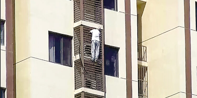 Video of 89-year-old woman falling off railing while locked in room.