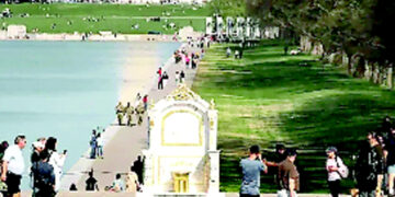 A mockery of the White House, a gold toilet is installed on the National Mall.