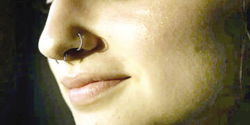 Part of nose ring gets stuck in woman’s lung.