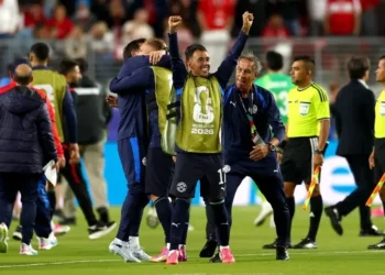Paraguay football team celebrating a 1-0 World Cup win against Turkiye