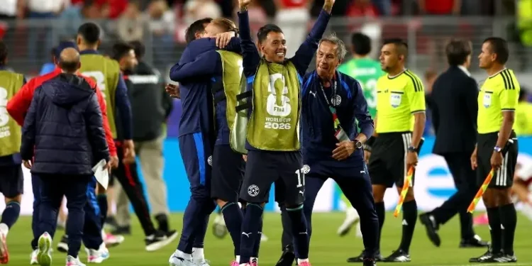 Paraguay football team celebrating a 1-0 World Cup win against Turkiye