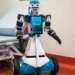 Humanoid healthcare robot assisting a patient in a hospital ward in Milan