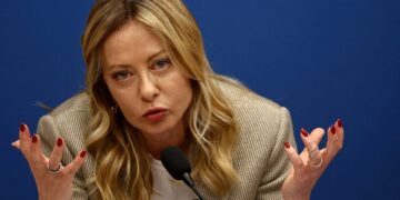 Giorgia Meloni and Donald Trump talking at the G7 summit in Évian-les-Bains amid Italy US diplomatic tensions over photo remarks.