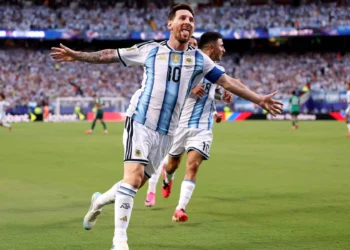 Lionel Messi celebrating after scoring a hat-trick for Argentina