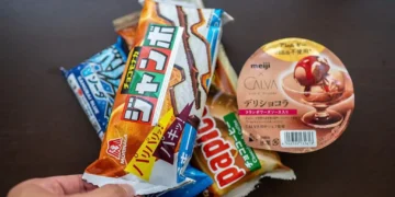 Ice cream products in Japanese supermarket with investigation concept overlay.