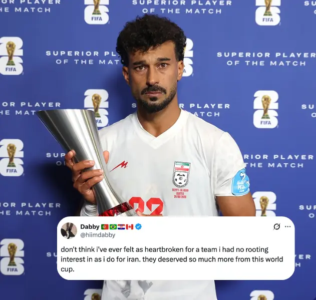 Iran defender Ramin Rezaeian holding the Player of the Match award after Iran's elimination from the FIFA World Cup.