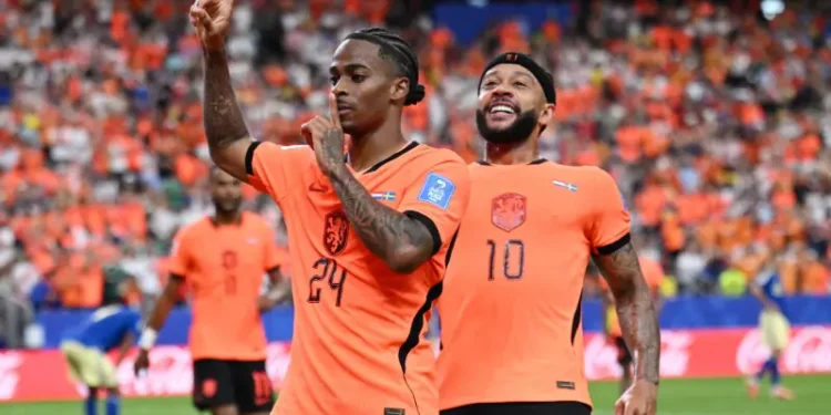 Netherlands players celebrate after defeating Sweden 5-1 in their World Cup group match