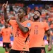 Netherlands players celebrate after defeating Sweden 5-1 in their World Cup group match