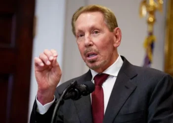 Oracle office building and data centre infrastructure representing job cuts and AI expansion in tech industry