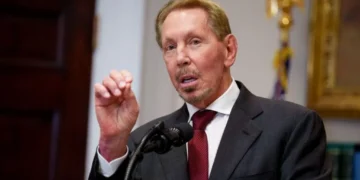 Oracle office building and data centre infrastructure representing job cuts and AI expansion in tech industry