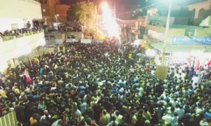 Emergency response and treatment following vehicle crash at Muharram gathering in Karachi.
