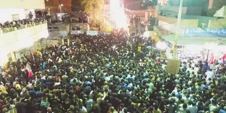 Emergency response and treatment following vehicle crash at Muharram gathering in Karachi.
