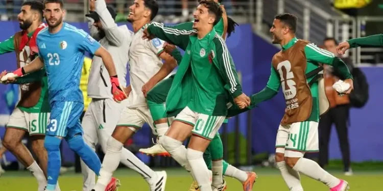Algeria players celebrating after scoring a late winning goal against Jordan in World Cup match