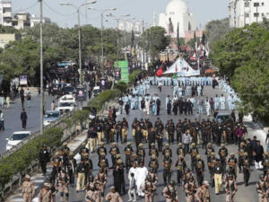 Sindh Police officers monitoring security arrangements during Ashura processions in Karachi.