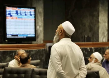Electronic board displays rising KSE-100 index at Pakistan Stock Exchange.