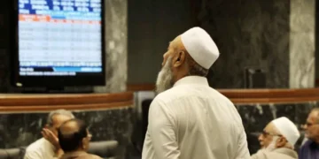 Electronic board displays rising KSE-100 index at Pakistan Stock Exchange.